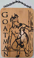 a wooden sign with a black and white illustration of a goat-like creature, possibly a mythical or fantastical animal, and the word "Goat" written on it.